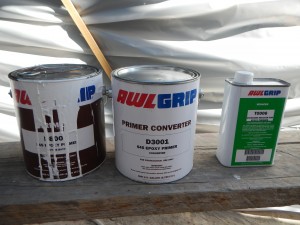 We used a two part epoxy primer by Awlgrip. The T0006 is a reducer needed when you are going to spray it on.